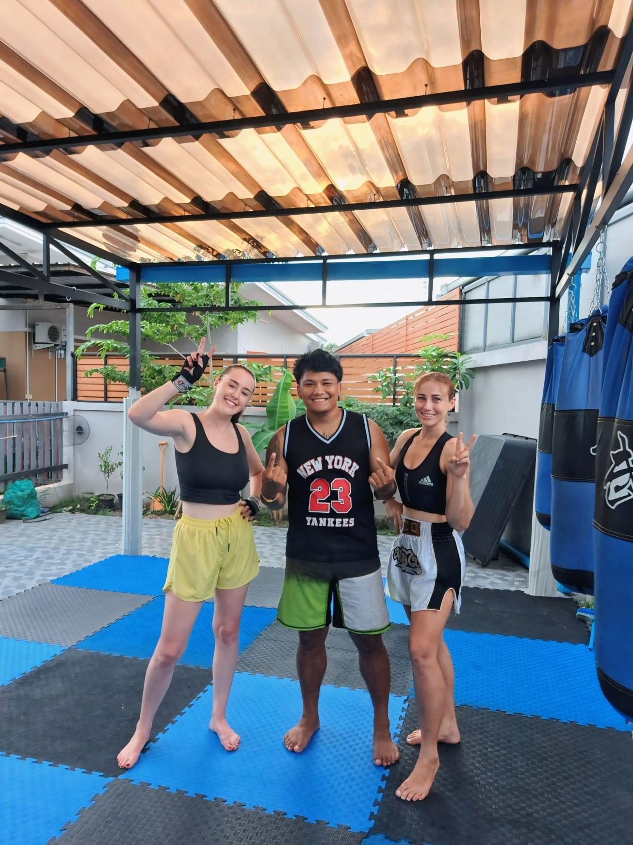 Kru Kitt training two visitors at the gym